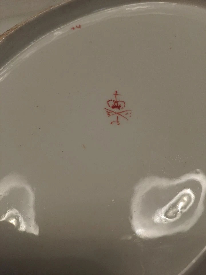 Close-up of the red crown mark on the back of a Derby lobed edged ceramic plate dish collectible