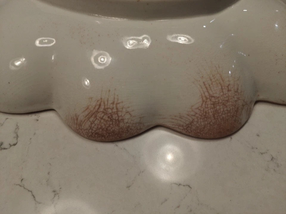 Close-up of Derby lobed edged ceramic plate dish with aged crackle glaze and brown discoloration marks