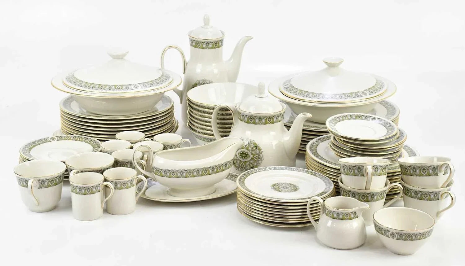 Classic vintage dinnerware pieces including teapots, cups, plates, and serving dishes with elegant floral patterns