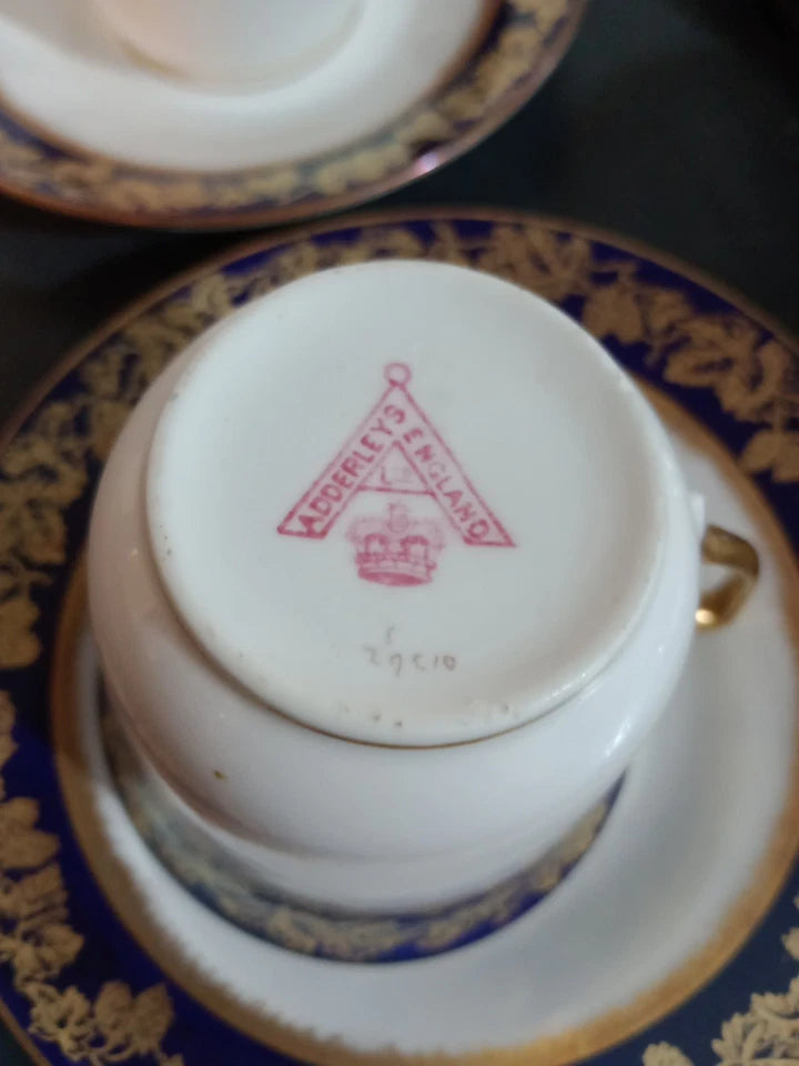 Adderleys cobalt blue tea set cup with gold floral pattern and maker's mark on the base