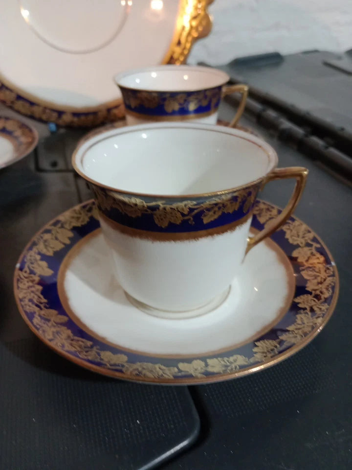 Adderleys cobalt blue tea set featuring elegant white cups and saucers with blue and gold leaf pattern trim