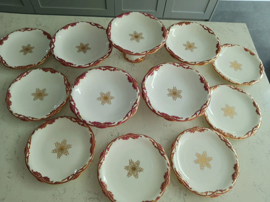 Antique Davenport dessert set Tazza comport plates 1840 with gold star detailing and red floral trim
