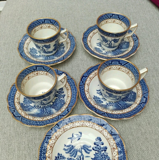 Set of Booths Real Old Willow cups saucers featuring blue and white willow pattern with gold trim
