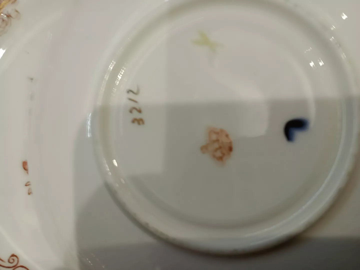 Close-up of markings on the base of antique Charles Amison tea trios porcelain plate