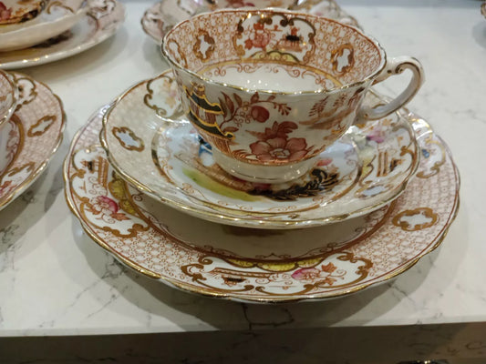 Antique Charles Amison tea trios set featuring delicate floral and gold detailing on fine china