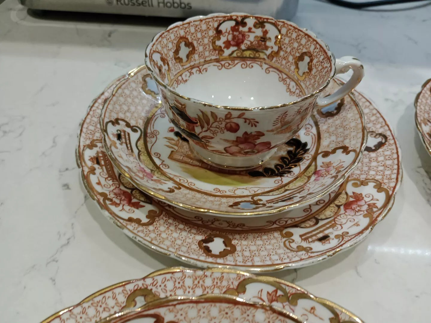 Antique Charles Amison tea trios featuring ornate floral design with gold accents and fine china craftsmanship