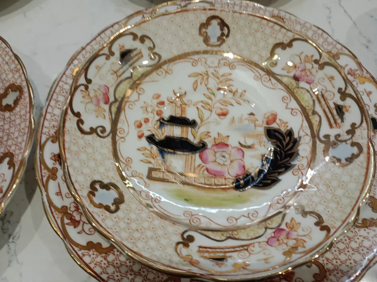 Decorative antique Charles Amison tea trios plate with floral and pagoda design accents in gold and pink