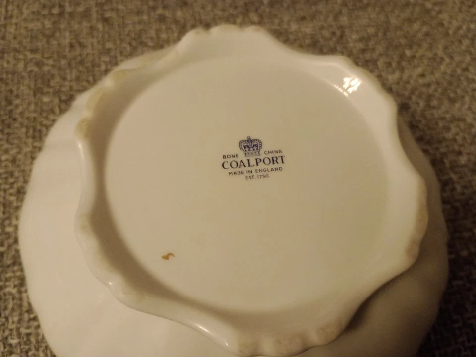 Base of Coalport Revelry powder box showing maker's mark and scalloped edges