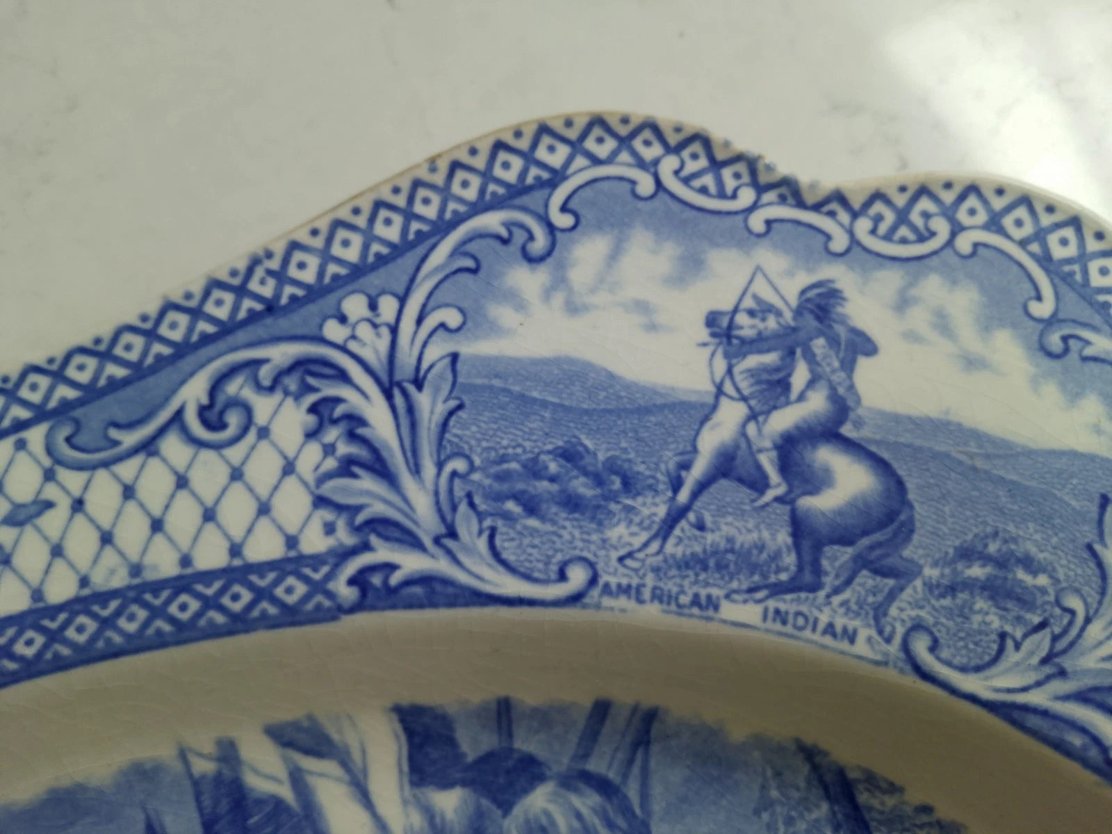 The First Sermon Ashore crown ducal plate featuring detailed blue American Indian centaur design