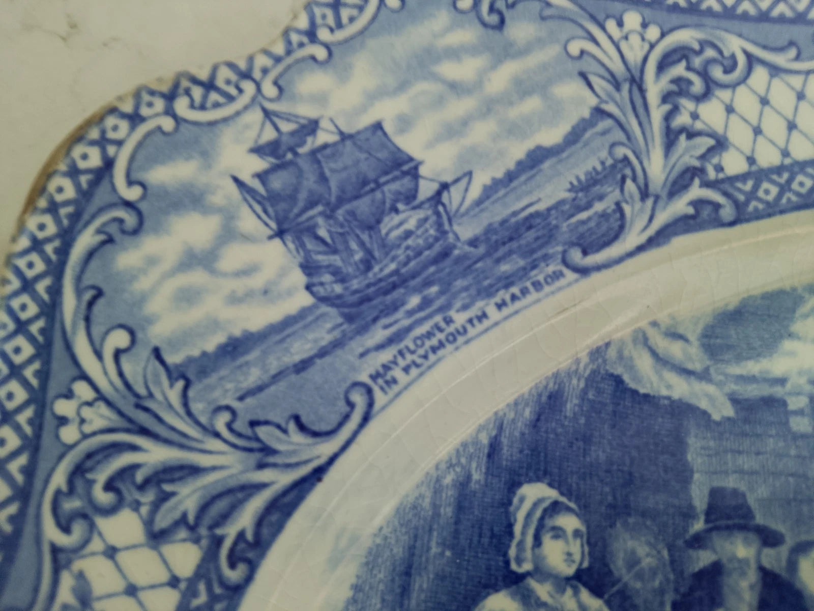 The First Sermon Ashore crown ducal plate with detailed blue ship and Plymouth Harbour border design