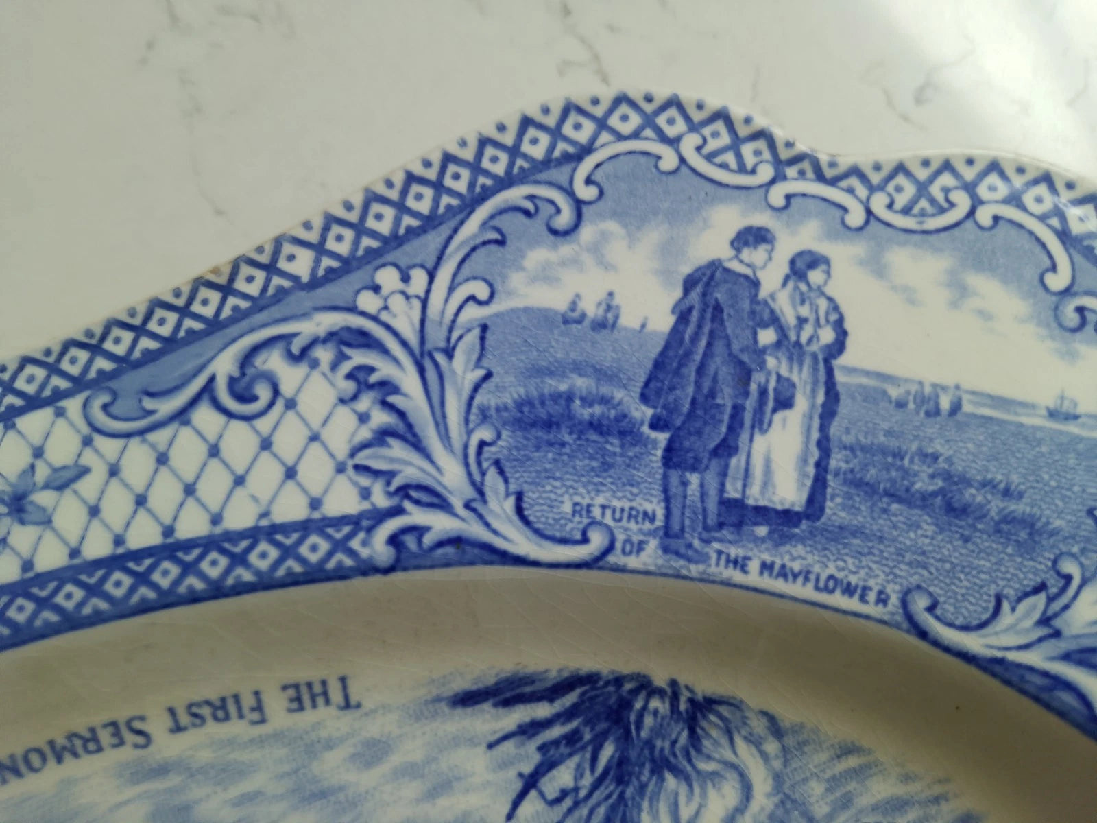 Close-up of The First Sermon Ashore crown ducal plate with blue detailed historic design by Crown Ducal