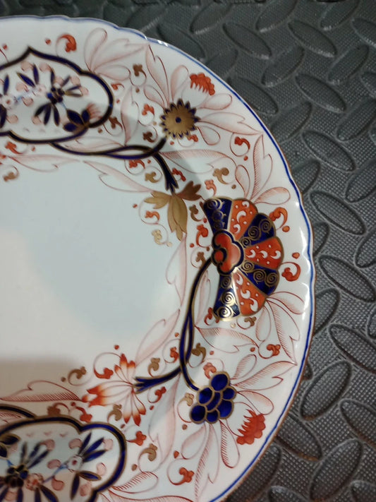 Copeland Spode Imari dinner plate with intricate blue, red, and gold floral design on white background
