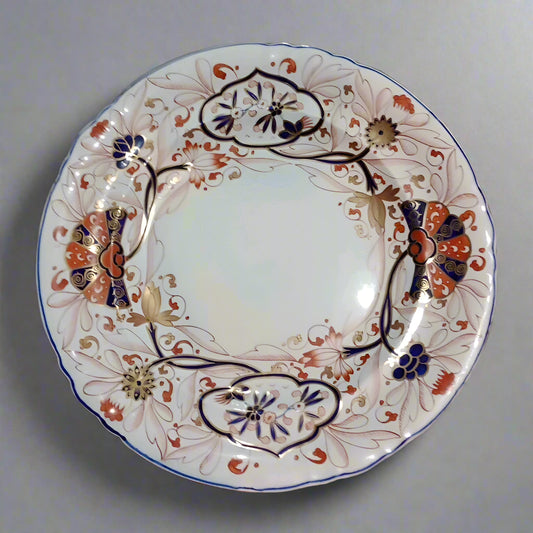 Copeland Spode Imari dinner plate with intricate floral and geometric patterns in blue, red, and gold