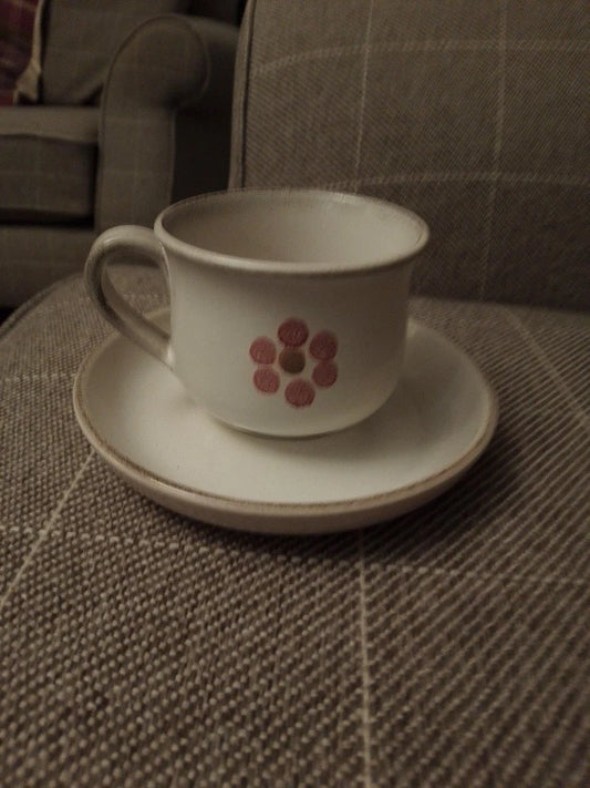 Denby Gypsy tea cup and saucer set with simple floral design on beige ceramic