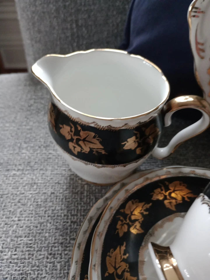Gladstone China tea set vintage black and gold leaf patterned cream jug and plates on grey fabric