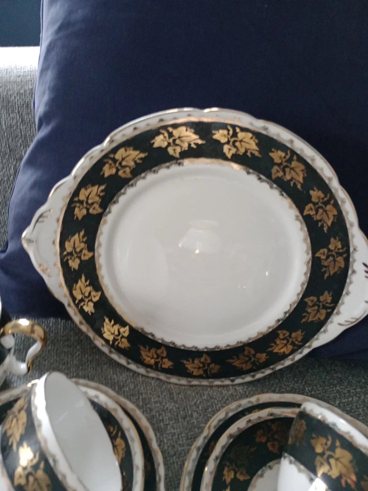 Gladstone China tea set vintage with elegant black and gold floral design on plates and cups