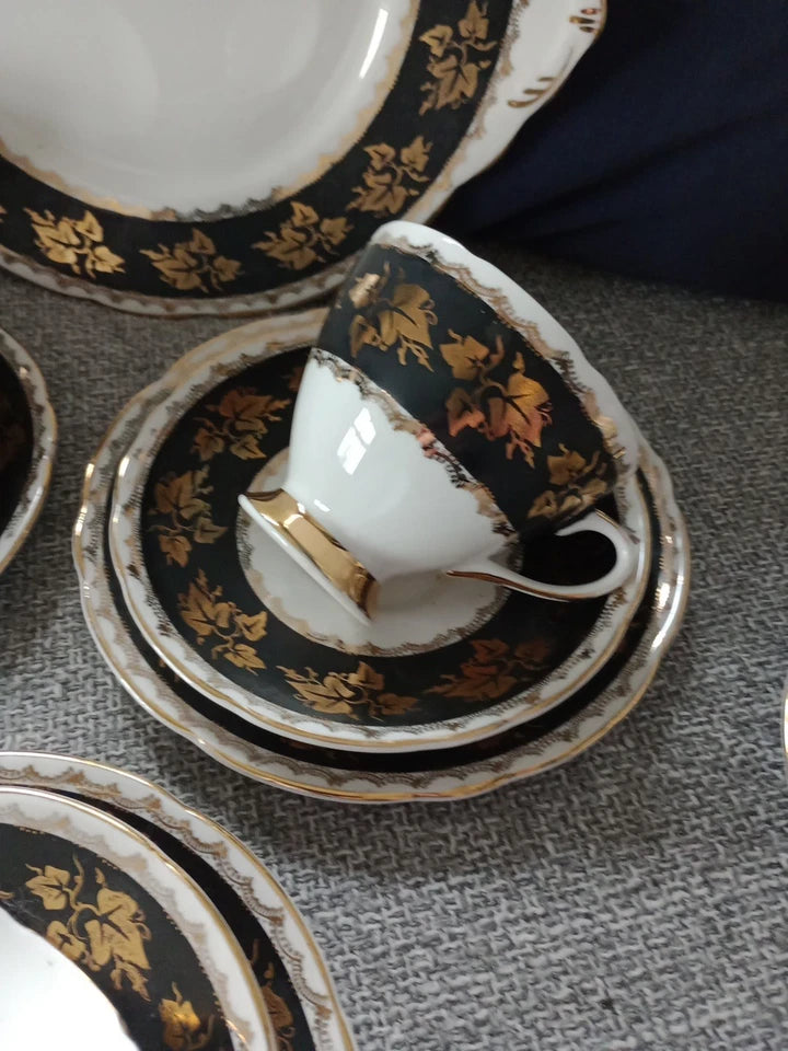 Gladstone China tea set vintage with black and gold floral design on cup and saucers