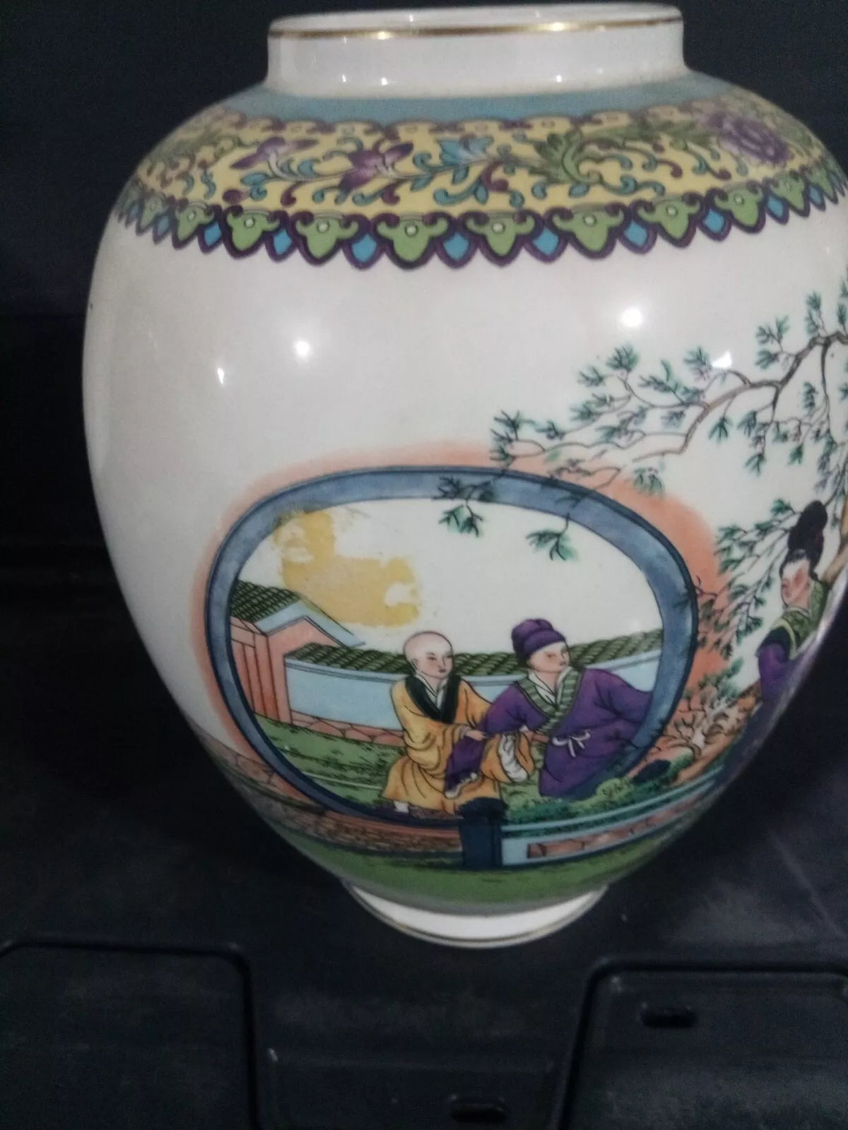 Japanese famille rose vase with traditional hand-painted scenes and intricate floral border design