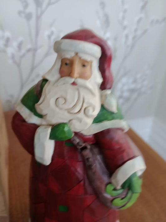 Jim Shore Santa Be A Blessing Ease A Burden 2019 figure in traditional red and green Christmas attire