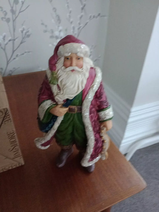 Jim Shore Victorian Santa figurine in detailed traditional red and green outfit with white beard