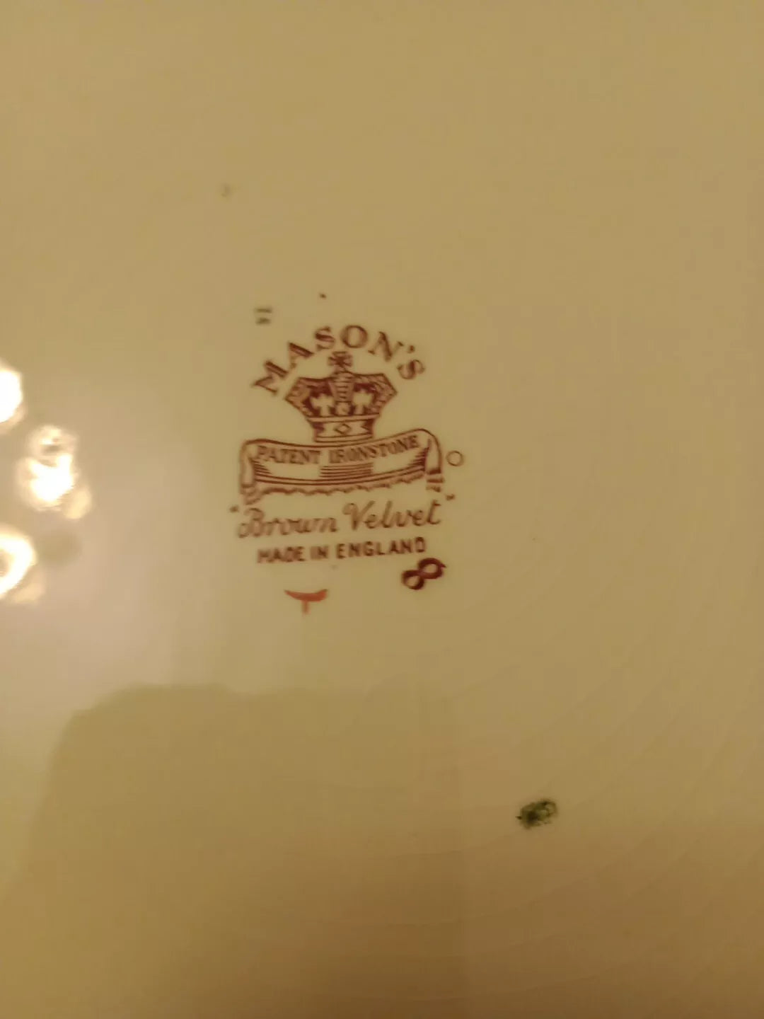 Close-up of Masons Brown Velvet charger plate backstamp showing brand and pattern details