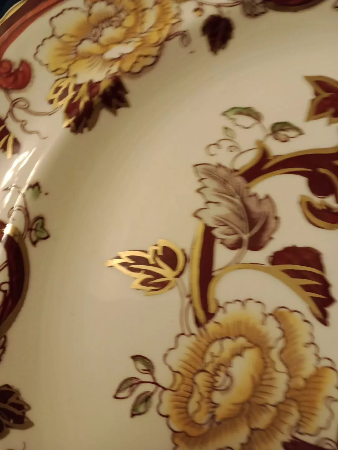 Close-up of Masons Brown Velvet charger plate showing intricate floral and gold leaf pattern decoration