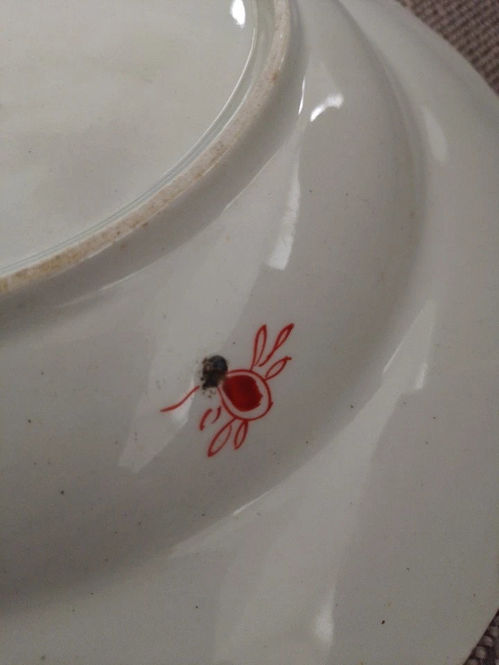Close-up of Masons Ironstone Imari soup plate mark and detail on the back of an antique plate