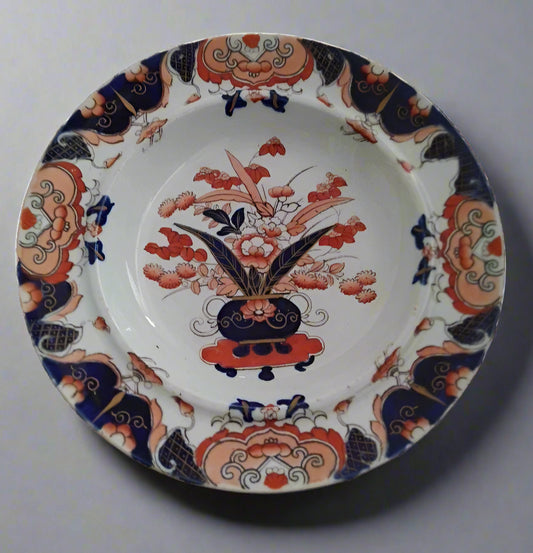 Masons Ironstone Imari soup plate with traditional floral and decorative patterns in blue and red