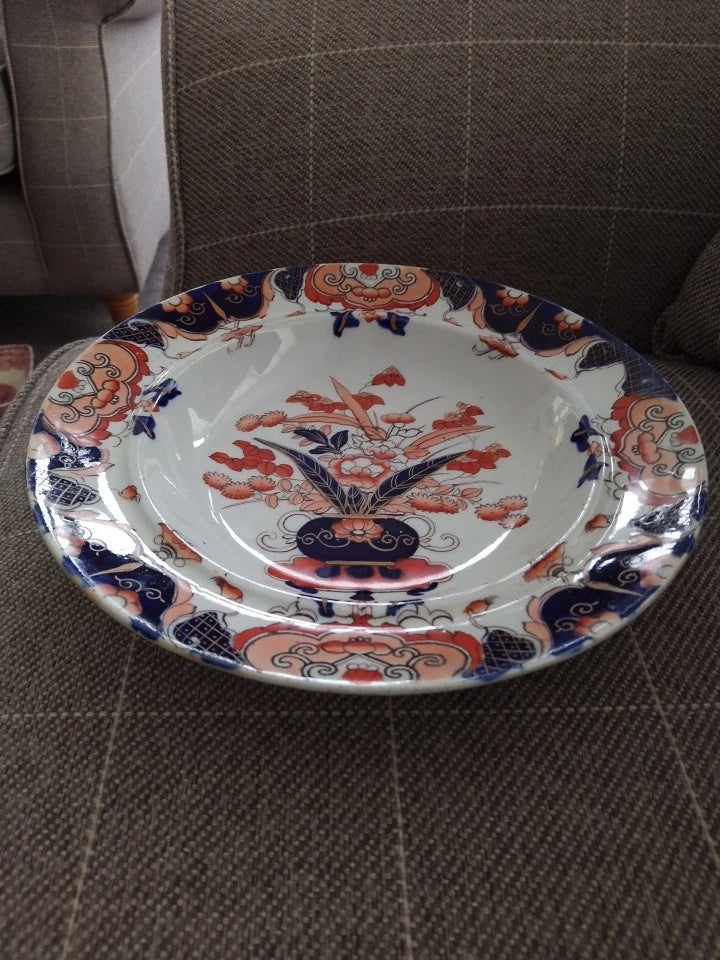 Masons Ironstone Imari soup plate with traditional floral and geometric patterns in blue and red