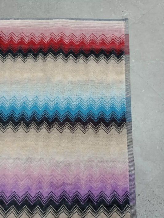 Missoni zig zag hand towels featuring vibrant multicolour chevron patterns on soft fabric