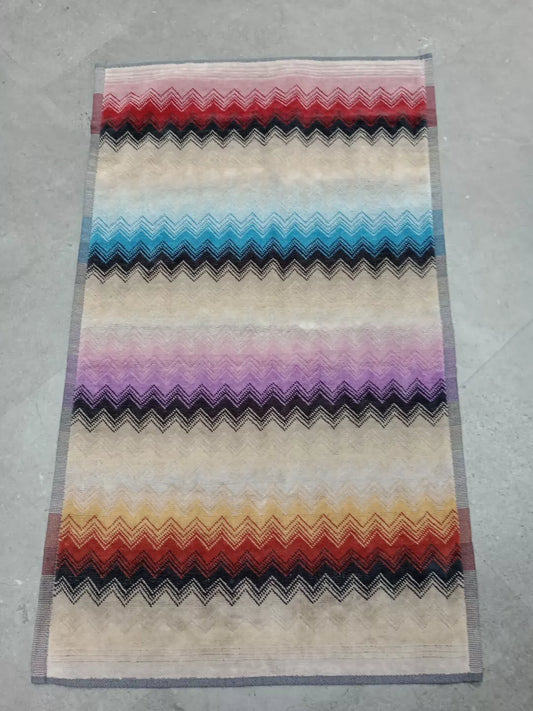 Missoni zig zag hand towels featuring multicolour chevron pattern in red blue purple and orange hues