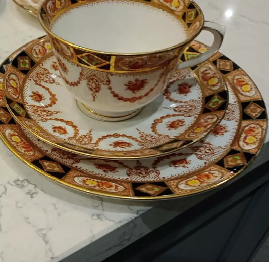 Vintage Devon Black Lovain tea set Royal Albert featuring ornate gold and floral detailing on cup and plates