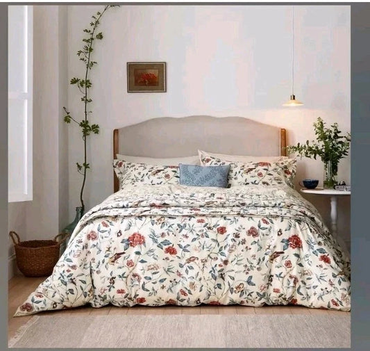 Sanderson Sissinghurst king duvet cover set with floral design on a king-size bed in a modern bedroom