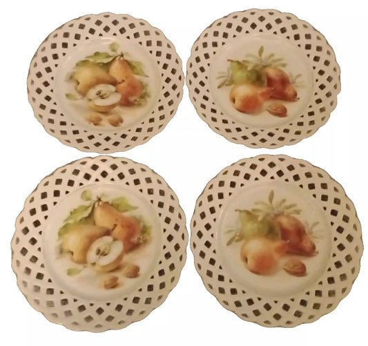 Schumann lace lattice plates set with fruit design and intricate cut-out edges in white