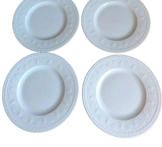 Set of four white Villeroy & Boch Cellini salad plates with embossed decorative pattern
